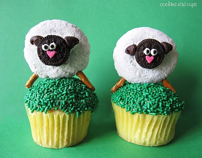 Two Cupcakes Sitting Side by Side with Easter Sheep on Top